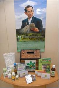 Photo of a medicine box, its contents, and a poster for the program