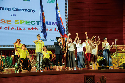 Photo of performers waving to the audience
