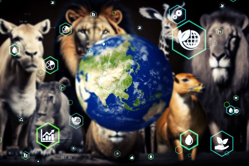 地球を中心に、ライオンやシカなどの野生動物と環境・エネルギーに関するアイコンが並ぶイメージ画像