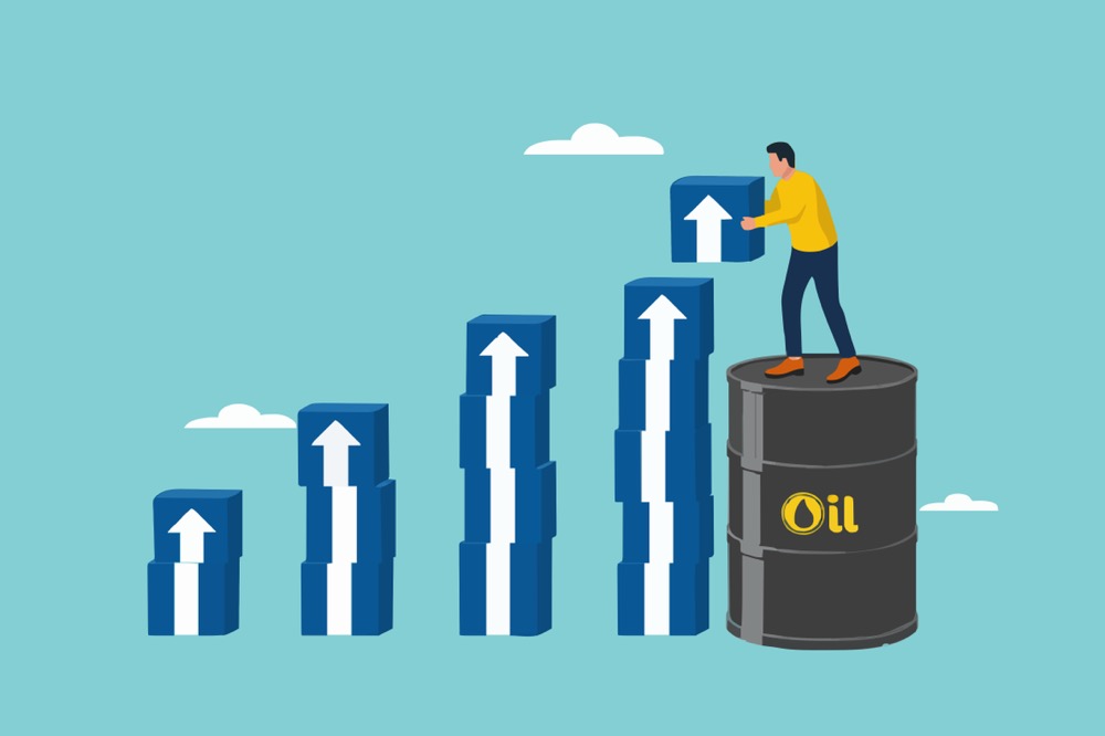 石油のドラム缶の上に立った人物が、上昇する矢印が描かれた青いブロックを積み上げているイラスト。エネルギー価格の上昇や資源に関連する経済的な成長を表現しています。
